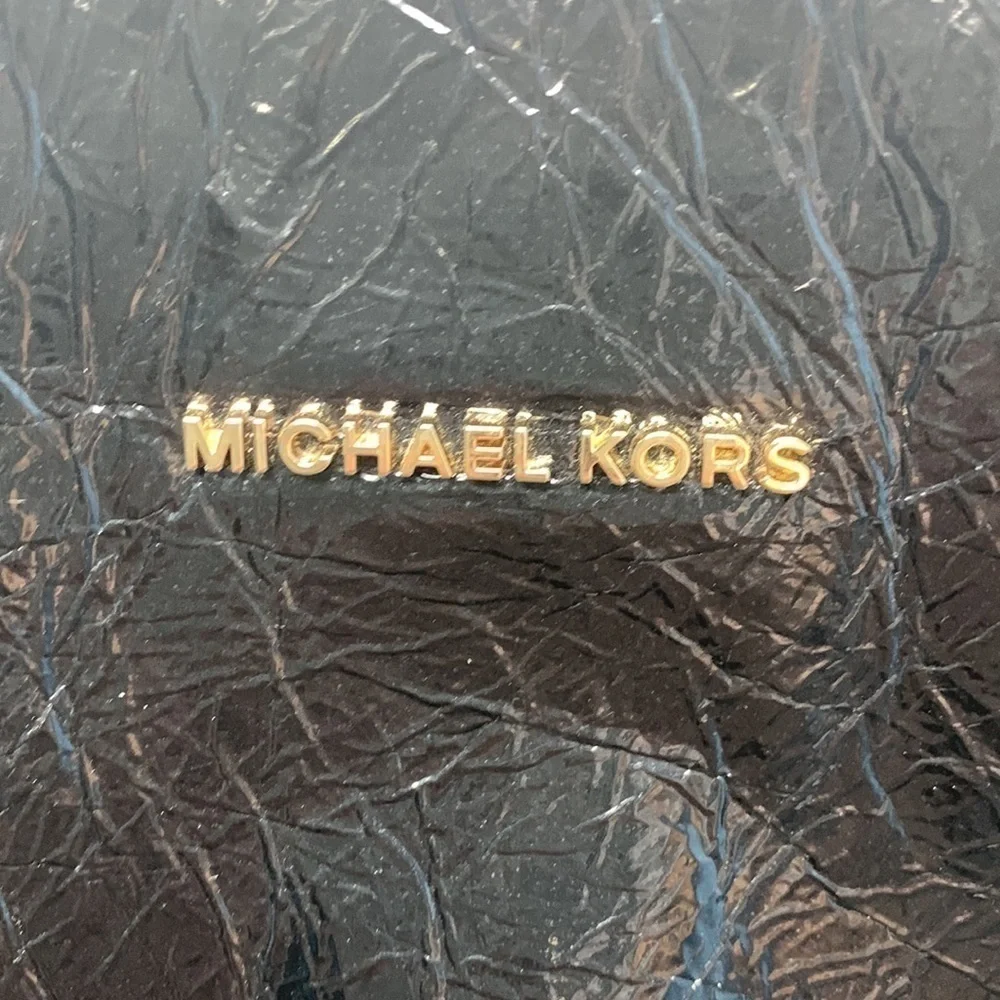 Michael Kors a black Vertical Tote.